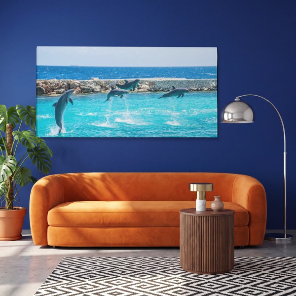 Dolphins in Motion Canvas Print - on the wall in a room interior