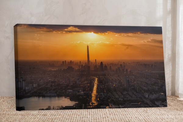 Sunrise Above the City Canvas Print - on the wall in a room interior